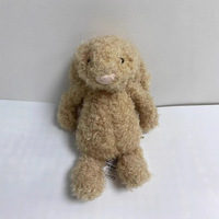 Peluche lapin beige à poils bouclés style vintage, oreilles tombantes et duveteuses