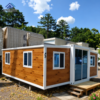 Atelier moderne préfabriqué modulaire extensible avec porte coulissante double à cadre en acier et panneaux ondulés personnalisés et fenêtre transom en verre