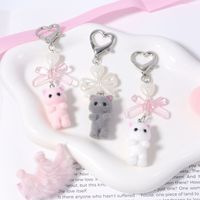 Porte-clés chaton mignon en PVC, pendentif en peluche floqué avec nœud perlé, porte-clés chat avec nœud pour téléphone portable, sac photo, breloques de sac