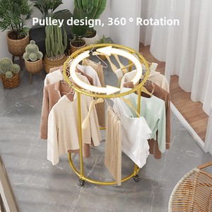 Bằng sáng chế mới sắt nghệ thuật đa chức năng một tầng tầng bánh xe xoay quần áo giá hiển thị đứng phòng khách khô kệ - Product Image 2