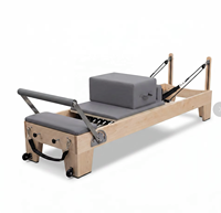 Reformer de Pilates en bois d'érable avec logo personnalisé, capacité de charge de 200 kg, lit d'entraînement pour le renforcement musculaire, équipement de yoga et de fitness pour studio