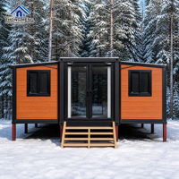 Maison modulaire extensible à double aile de 20, 30 ou 40 pieds avec porte d'entrée centrale en verre pour maison-conteneur de jardin