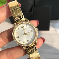 Montre pour femme avec lunette en cristal, cadran en nacre or rose, grands chiffres, élégante, à quartz, résistante à l'eau, cadeau
