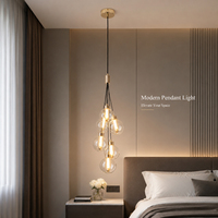 Suspension LED contemporaine verticale élégante en cascade, en fer doré de luxe et verre transparent, longue, pour éclairage d'ambiance