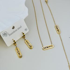 Ensemble de bijoux pour femmes, collier, bracelet et boucles d'oreilles en acier inoxydable plaqué or avec breloques en cristal coulissant - Product Image 6