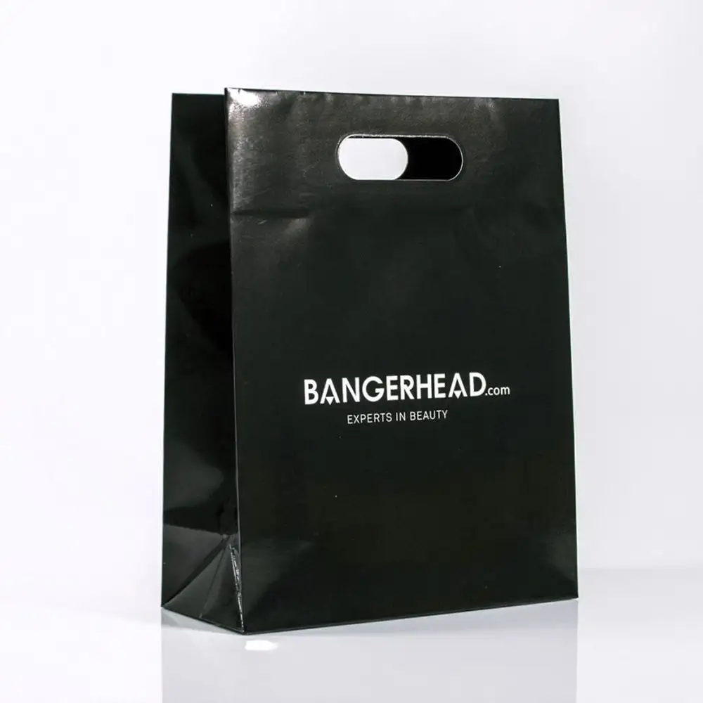 Bolsa de papel Kraft troquelado para compras, bolsa de regalo Biodegradable, con solapa navideña, mango troquelado, color negro