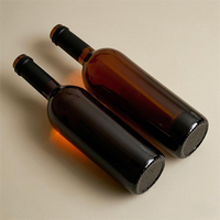 Botella de vino de vidrio de calidad superior de fábrica de China Botella de vino de color transparente en stock