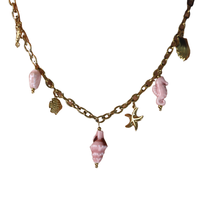Bijoux transfrontaliers : Bracelet doux style plage avec étoiles de mer et pendentifs ; Collier en céramique coquillage et hippocampe