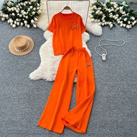 Ensemble décontracté deux pièces pour femme : haut à manches courtes et pantalon large avec décorations métalliques – Tenue élégante pour la détente