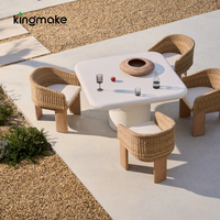 Table en ciment résistante aux intempéries en gros pour hôtels et complexes hôteliers, avec mobilier en rotin tressé, idéale pour ensemble de canapés d'extérieur