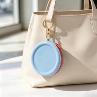 Pochette de maquillage circulaire en silicone, sac de rangement pour écouteurs, rouge à lèvres, câble de données, sac portable à fermeture éclair avec porte-clés