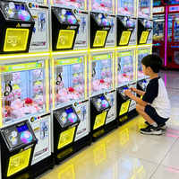 Vente en gros usine : Machine à griffes en métal à monnayeur, jeu d'arcade à bonbons, avec garantie d'un an, mini machine à griffes pour poupées et jouets en peluche