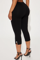 Pantalon Capri pour femme à taille élastique et taille haute, avec détail nœud, couleur unie, coupe évasée, ourlet fendu, coupe ample et respirant