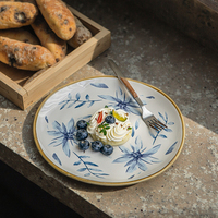 Assiette en porcelaine florale bleue écologique à prix réduit Vente en gros Assiette en céramique de vente en ligne