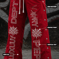 Pantalon de survêtement large personnalisé rouge en nylon résistant à l'eau avec broderie et boutons-pression latéraux détachables pour le streetwear urbain