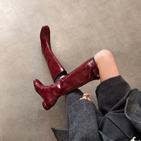 Bottes longues matelassées à motif losanges, bout rond et talon carré bas