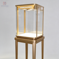 Vitrine moderne en verre et acier inoxydable avec éclairage LED et design rotatif pour magasin de détail