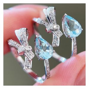 Bague Xinfly en or 18 carats avec nœud en ruban, diamant naturel et aigue-marine, design tendance papillon et goutte d'eau pour mariages, cadeaux et fêtes - Product Image 1