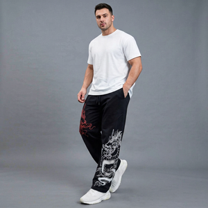 Pantalon de survêtement noir pour homme, imprimé dragon, taille élastique avec cordon de serrage, style décontracté, respirant, en coton léger, avec poches latérales - Product Image 1