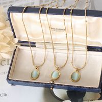 Collar de Acero de Titanio con Colgante de Piedra Ojo de Gato y Cadena de Oro de 18k de Estilo Vintage de Alta Gama para Mujer