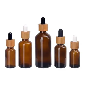 Kemasan Kosmetik Kayu 5Ml 10M 15Ml 20Ml 30Ml 50Ml 100Ml Botol Minyak Esensial Kaca Amber dengan Tutup Penitis Kayu Bambu