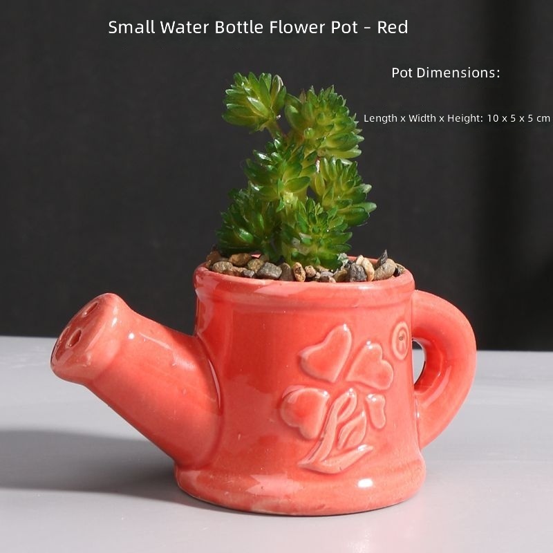 Piccolo annaffiatoio per vaso di fiori rosso