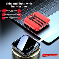 Vente en gros de banque d'alimentation portable avec logo personnalisé Capacité de 10000mAh Matériau en PVC Interface d'entrée micro USB Câble intégré 10W LI-Polymer