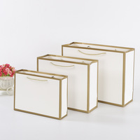 Feuille d'or de luxe personnalisée en relief mat laminé petite entreprise Logo blanc cadeau papier robuste magasin de vêtements sac à provisions