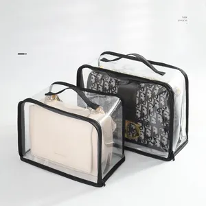 थोक पीवीसी क्लियर बैग वाटरप्रूफ मल्टीफ़ंक्शन प्लास्टिक स्टोर बैग हैंडल के साथ पारदर्शी सामान धूल बैग कॉस्मेटिक हैंडबैग