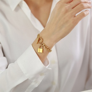 สร้อยข้อมือดีไซน์เนอร์ OT Clasp Lock Charms  วัสดุสแตนเลสสตีล 316L  แบบ Cuban Miami Link Chain สีทอง - Product Image 5