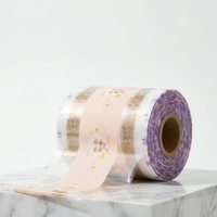 Film laminé personnalisé en rouleau pour machines d'emballage automatiques, film imprimé de qualité alimentaire pour snacks et biscuits