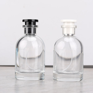 Bottiglia vuota da 100ML con tappo in bianco <span class=keywords><strong>e</strong></span> nero a doppio strato corpo trasparente <span class=keywords><strong>e</strong></span> bottiglia di vetro per profumo - Product Image 1