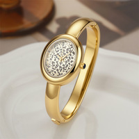Montre-bracelet de luxe pour femme avec cadran léopard, montre à quartz ovale dorée de haute qualité pour femme, design de niche, vente en gros
