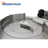 Machine de remplissage et de bouchage automatique de table Moonpack pour petites bouteilles d'huile essentielle, de lait et d'huile de cuisson
