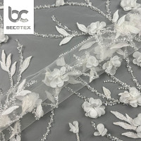 Tissu de dentelle nuptiale à prix d'usine, broderie 3D perlée et pailletée pour robe de mariée