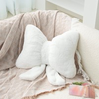 Le coussin adorable en forme d'arc, très populaire