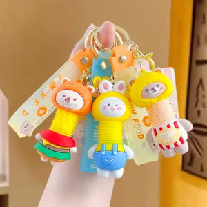 Vente en gros de porte-clés de poupée télescopique créative avec colle pendentifs de sac livre de voiture pour femmes avec dessin animé mignon petit cadeau pour couple