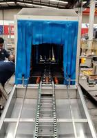 Laveuse industrielle de paniers, caisses et plateaux en plastique pour la manutention