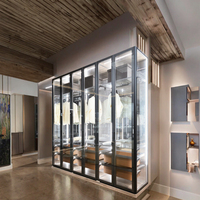 Armoire de chambre moderne modulaire personnalisée en bois, métal et verre avec portes coulissantes, 4-6 étagères, éclairage intégré, facile à nettoyer, montage au sol