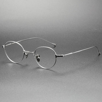 Lunettes optiques en titane pur, montures de lunettes de vue ovales unisexes tendance, vente en gros de lunettes pour hommes et femmes