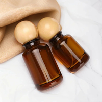 Vente en gros d'usine, flacon pulvérisateur de parfum en verre rechargeable de 30 ml, 50 ml, 100 ml, cylindrique, avec bouchon en bois