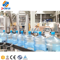 Machine de remplissage d'eau potable pure minérale en fûts de 5 gallons, 600 BPH, ligne de lavage, remplissage et bouchage 3-en-1