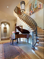 Escalier courbé en métal style américain populaire avec marches en bois massif noyer pour intérieur