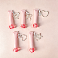 Tube de gloss sphérique avec couvercle à vis, tube cosmétique à air comprimé avec chaîne, tube de crème pour les yeux avec applicateur en silicone souple