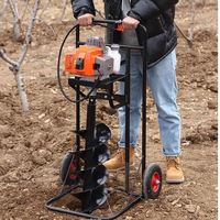 La perceuse à essence portative de 5,5 kW à quatre temps est utilisée pour planter des arbres et creuser des trous dans les jardins