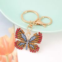 Porte-clés Papillon Créatif Scintillant et Coloré en Alliage Métallique Léger avec Strass pour Décoration de Sac à Main Femme
