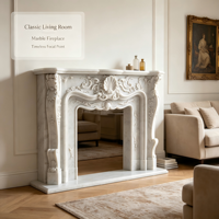 Manteau de cheminée en marbre blanc de luxe. Encadrement élégant en pierre naturelle sculptée à la main de style français pour la décoration classique du salon.