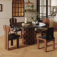 Table à manger ronde en pierre frittée noire Wabi Sabi de style vintage français, noyer du milieu du siècle, écologique et durable pour appartement et hôtel
