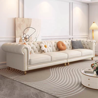 Canapé en cuir véritable de style français, trois places, en forme de L, couleur crème, pieds en bois massif, détails zippés, luxe léger, salon