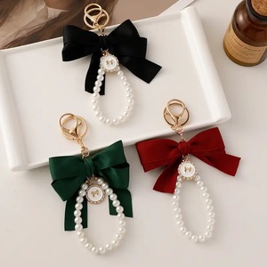 Élégant Mignon Arc Sac Charme Faux Perle Perlé Bracelet Téléphone Longe Sangle De Voiture Marque Porte-clés Cadeaux Fête Des Mères